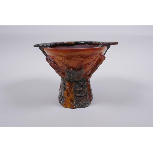 140 - A Chinese sectional horn libation cup with carved decoration of figures in a landscape, 19 x 15cm, 1... 