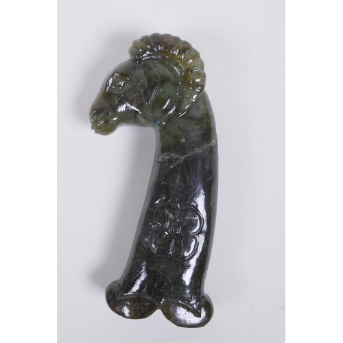 144 - A Murghal style green hardstone dagger handle carved in the form of a ram's head, 14cm long, AF