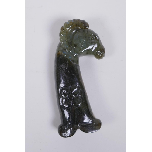 144 - A Murghal style green hardstone dagger handle carved in the form of a ram's head, 14cm long, AF