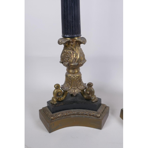 146 - A pair of Empire style bronze and ormolu Corinthian four branch table lamps, 98cm high