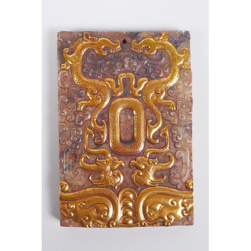 148 - A Chinese carved jade tablet with applied gilt metal detail to the dragon and phoenix, 8 x 12cm