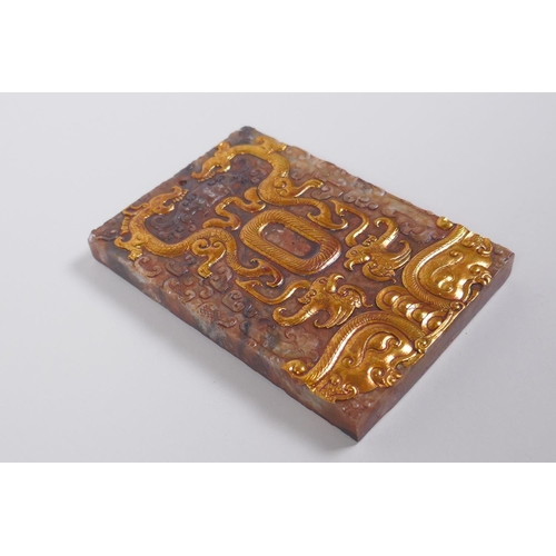 148 - A Chinese carved jade tablet with applied gilt metal detail to the dragon and phoenix, 8 x 12cm