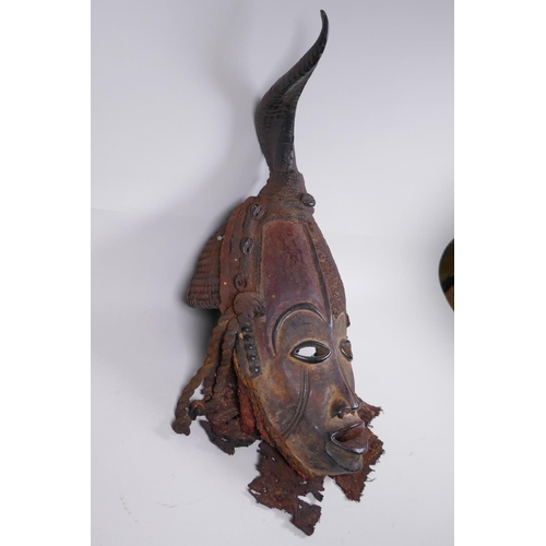 16 - An antique African Igbo tribe carved and painted wood and horn mounted spirit mask, 45cm