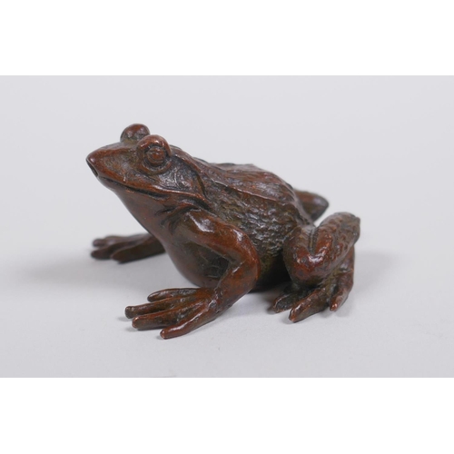 160 - A Japanese style bronze okimono toad, mark to base, 4cm long