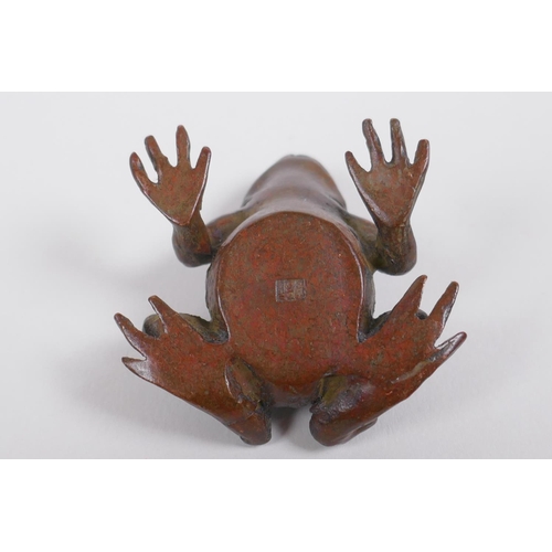 160 - A Japanese style bronze okimono toad, mark to base, 4cm long