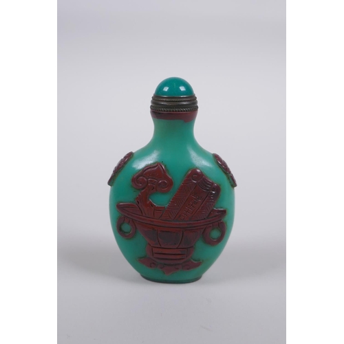 165 - A Peking glass snuff bottle with raised decoration of objects of vitue