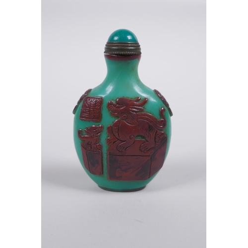 165 - A Peking glass snuff bottle with raised decoration of objects of vitue