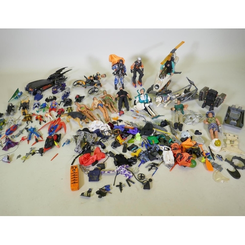 167 - A large collection of Action Man toy dolls with various vehicles, dogs, clothing and accessories, to... 