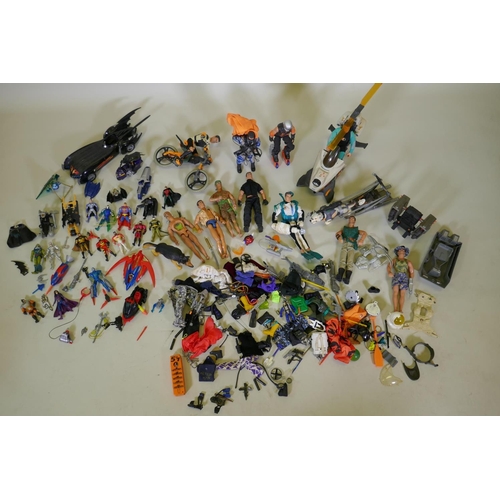 167 - A large collection of Action Man toy dolls with various vehicles, dogs, clothing and accessories, to... 