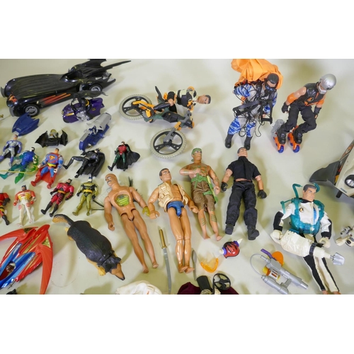 167 - A large collection of Action Man toy dolls with various vehicles, dogs, clothing and accessories, to... 