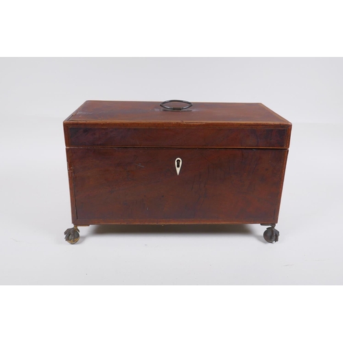 174 - A C19th mahogany tea caddy with banded inlay and brass ball and claw feet, 33 x 18cm 19cm high