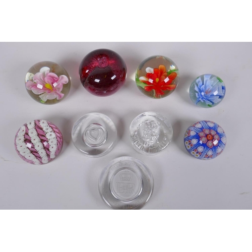 175 - A collection of art glass paperweight including two millefiori, three with floral decoration etc, la... 