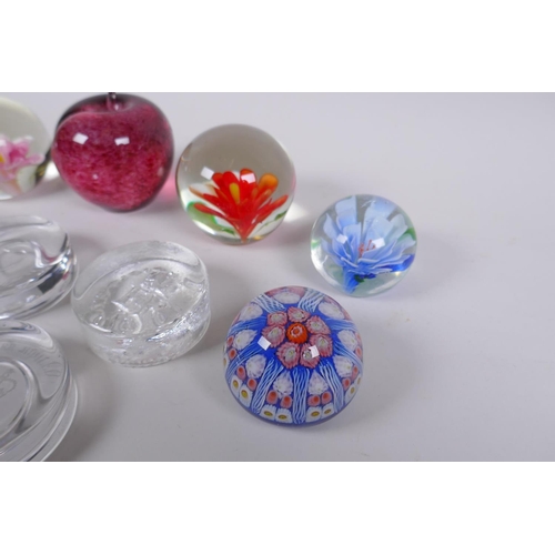 175 - A collection of art glass paperweight including two millefiori, three with floral decoration etc, la... 