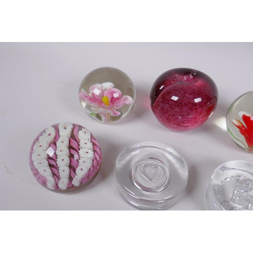 175 - A collection of art glass paperweight including two millefiori, three with floral decoration etc, la... 