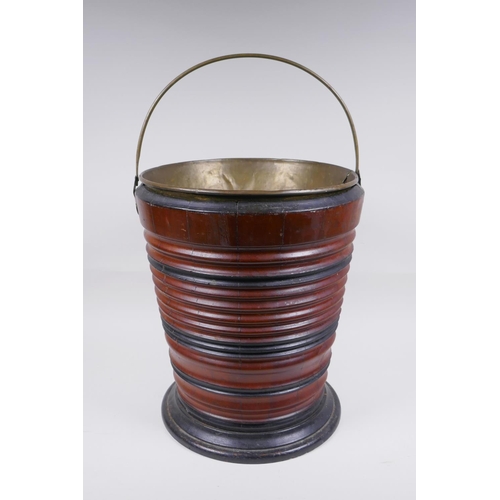 176 - A Dutch coopered fruitwood and brass lined peat bucket, 34cm high, 28cm diameter