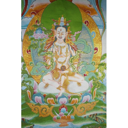 180 - A Tibetan embroidered thangka with gilt thread highlights, 90 x 62cm