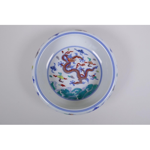 188 - A Chinese Doucai porcelain dish with rolled rim, decorated with dragons, Chenghua 6 character mark t... 