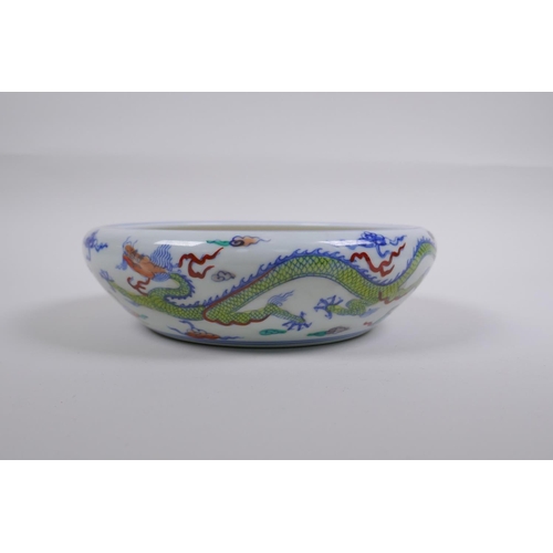 188 - A Chinese Doucai porcelain dish with rolled rim, decorated with dragons, Chenghua 6 character mark t... 