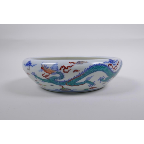 188 - A Chinese Doucai porcelain dish with rolled rim, decorated with dragons, Chenghua 6 character mark t... 