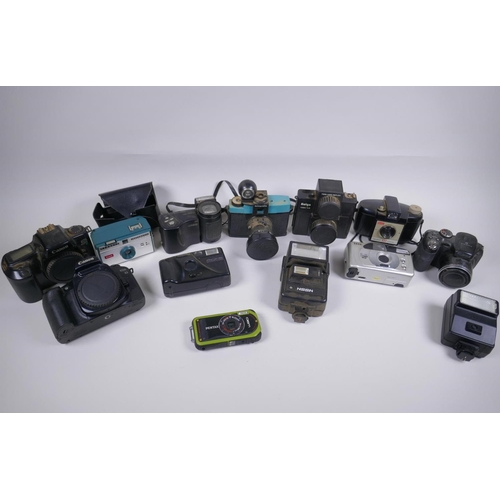 189 - A collection of assorted 35mm, 120mm and digital cameras and accessories including Canon ECS 1000F a... 