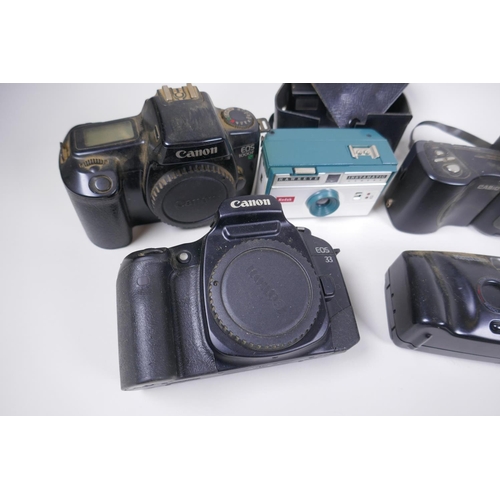 189 - A collection of assorted 35mm, 120mm and digital cameras and accessories including Canon ECS 1000F a... 