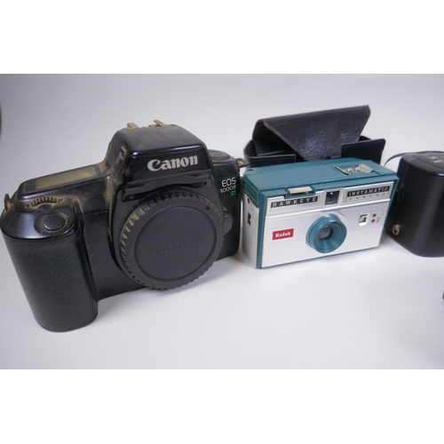 189 - A collection of assorted 35mm, 120mm and digital cameras and accessories including Canon ECS 1000F a... 