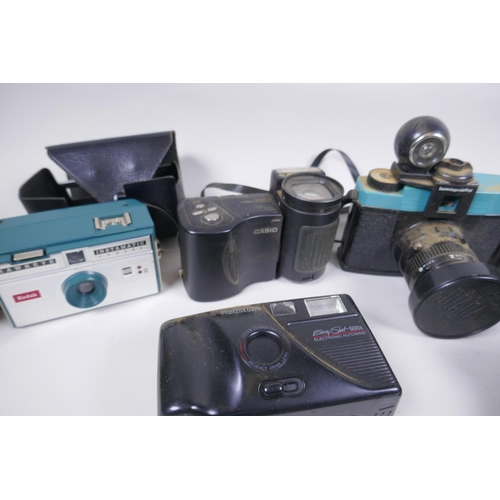 189 - A collection of assorted 35mm, 120mm and digital cameras and accessories including Canon ECS 1000F a... 