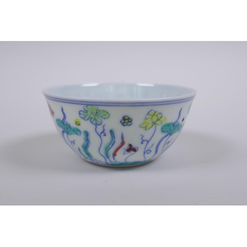 190 - A Doucai porcelain tea bowl with lotus pond decoration, Chinese Chenghua 6 character mark to base, A... 