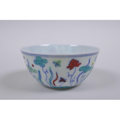 190 - A Doucai porcelain tea bowl with lotus pond decoration, Chinese Chenghua 6 character mark to base, A... 