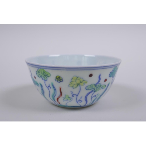 190 - A Doucai porcelain tea bowl with lotus pond decoration, Chinese Chenghua 6 character mark to base, A... 