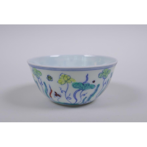 190 - A Doucai porcelain tea bowl with lotus pond decoration, Chinese Chenghua 6 character mark to base, A... 