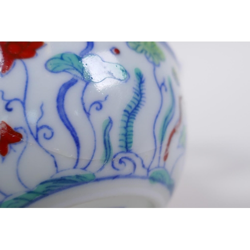 190 - A Doucai porcelain tea bowl with lotus pond decoration, Chinese Chenghua 6 character mark to base, A... 