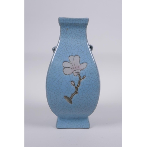 191 - A Chinese celadon crackle glazed porcelain vase with two handles and floral decoration, 21cm high