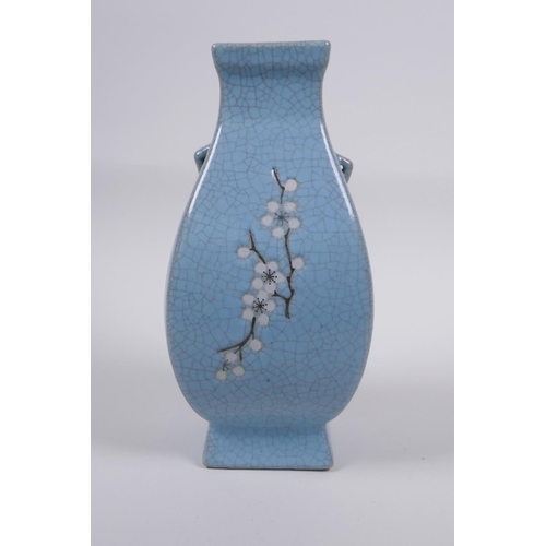 191 - A Chinese celadon crackle glazed porcelain vase with two handles and floral decoration, 21cm high