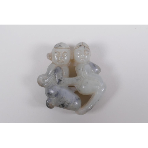 195 - A Chinese carved grey hardstone pendant of erotic form, and a carved crystal phallic pendant, 8cm lo... 