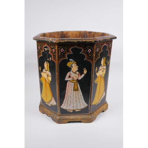 197 - An Indian octagonal wood planter with hand painted figural decoration to each panel, 31cm high