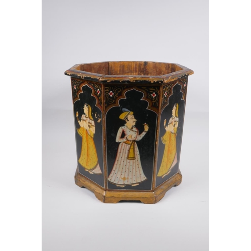 197 - An Indian octagonal wood planter with hand painted figural decoration to each panel, 31cm high