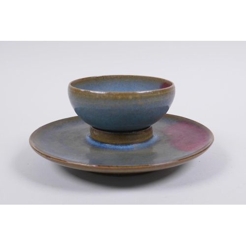 201 - A Chinese Jun ware tea bowl and saucer, 14cm diameter