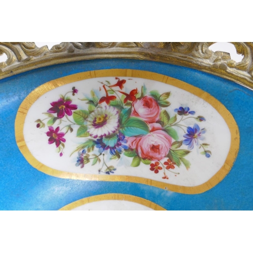 202 - An ormolu mounted Sevres style porcelain centrepiece with decorative panels depicting a courting cou... 