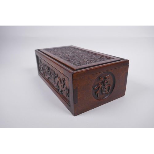 203 - A Chinese carved hardwood box with dragon and character decoration, 28 x 16cm