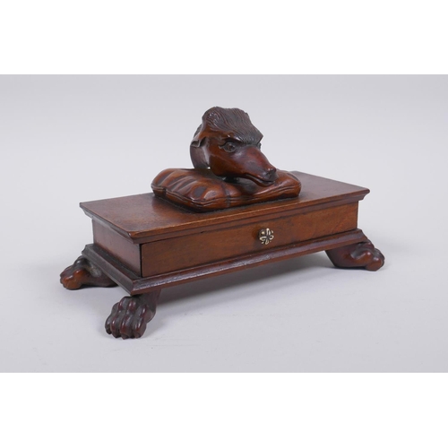 21 - A C19th mahogany Black Forest needle box with a deer head mount and carved paw feet, 20 x 10cm