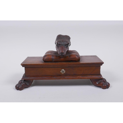 21 - A C19th mahogany Black Forest needle box with a deer head mount and carved paw feet, 20 x 10cm