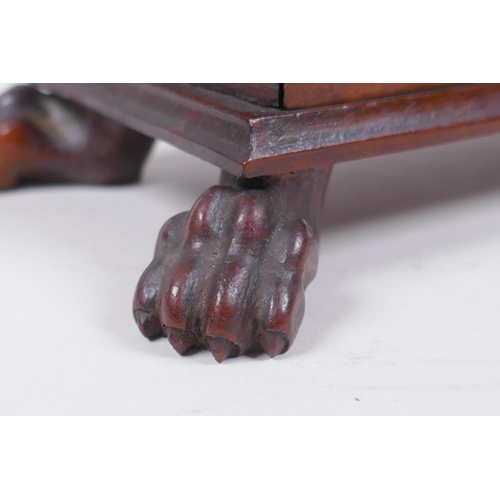 21 - A C19th mahogany Black Forest needle box with a deer head mount and carved paw feet, 20 x 10cm