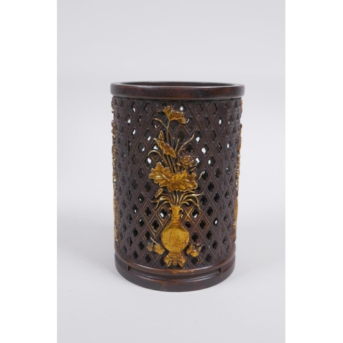 213 - A Chinese pierced bronze brushpot decorated with flowers in vases highlighted with gilt, 12cm high x... 