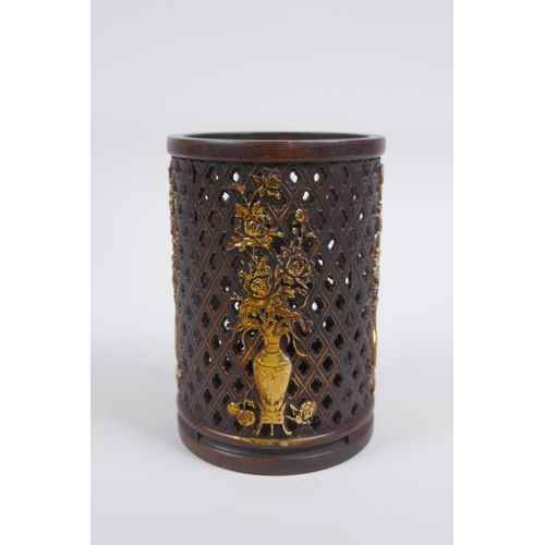 213 - A Chinese pierced bronze brushpot decorated with flowers in vases highlighted with gilt, 12cm high x... 