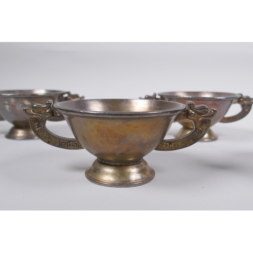 218 - A set of five Chinese silvered metal cups/bowls with two dragon handles, 10 cm diameter