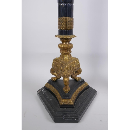 26 - A pair of Empire style bronze and ormolu Corinthian column four branch candelabra, 80cm high