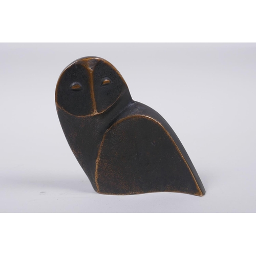 27 - A stylised solid bronze owl sculpture, 10cm high