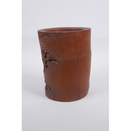 28 - A late C19th/early C20th Chinese carved bamboo brush pot decorated with scholars in a bamboo forest,... 