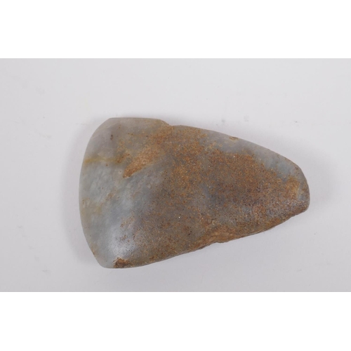 29 - A Neolithic polished hardstone axe head, 8 x 5cm